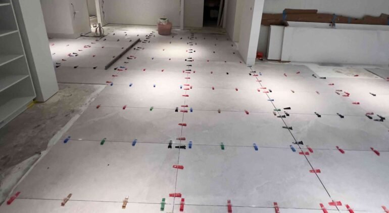 homeowner-consulting-with-tiler-sample-tiles-melbourne-service