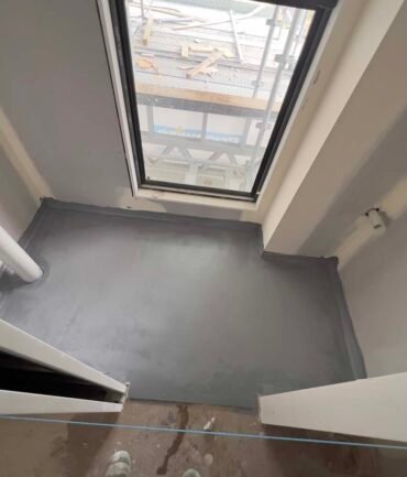 liquid waterproofing membrane application with brush detail shower corners