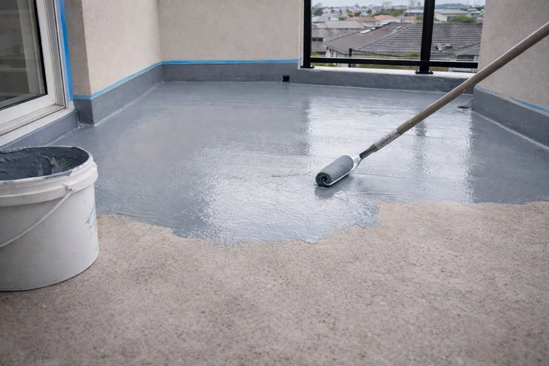Professional balcony waterproofing membrane installation during leak repair in Melbourne