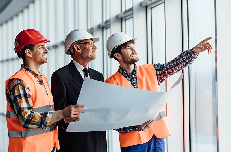 Construction jobs Melbourne professionals reviewing building plans
