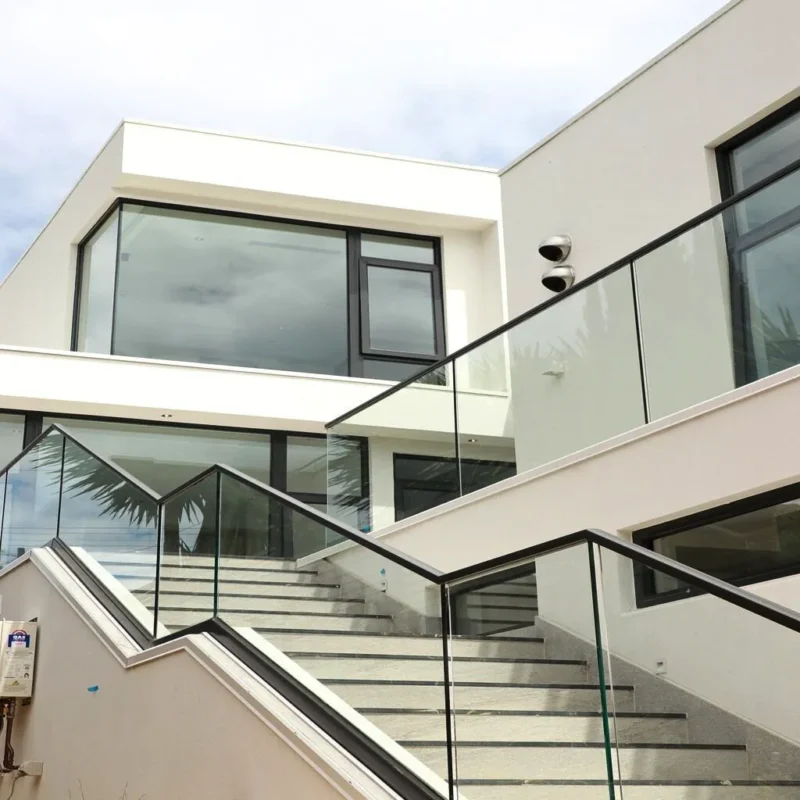 Modern rendered house exterior with balcony in Melbourne