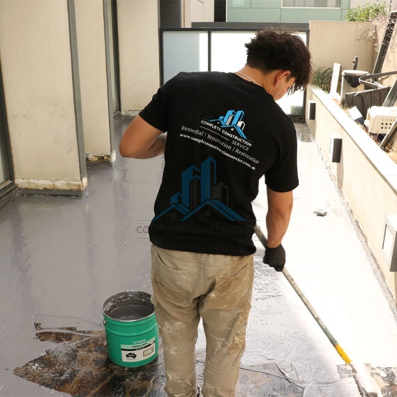 Applying waterproof coating during leak repair services in Melbourne