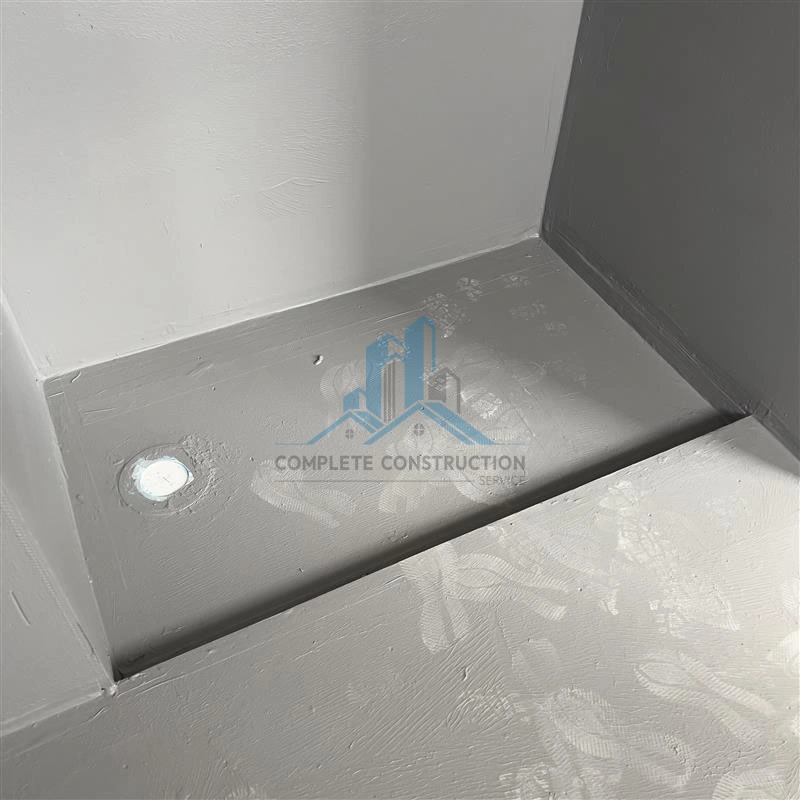 Waterproofed shower floor corner