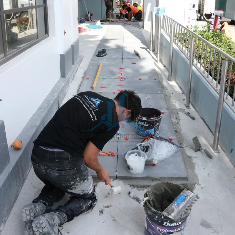 Tradeperson Installing Porch Paver in Glen Eira Counsel Melbourne