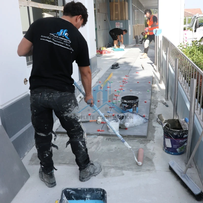 Tradeperson Installing Porch Paver in Glen Eira Counsel Melbourne
