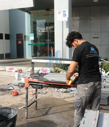 Tradepreson Cutting the Pavers for installation in Melbourne