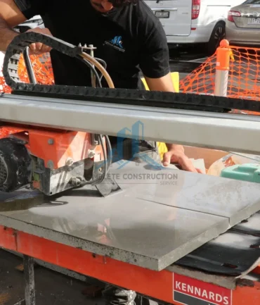Tradepreson Cutting the Pavers with Machine for installation in Melbourne