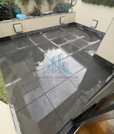 Completed balcony waterproofing and pedestal pavers in Port Melbourne
