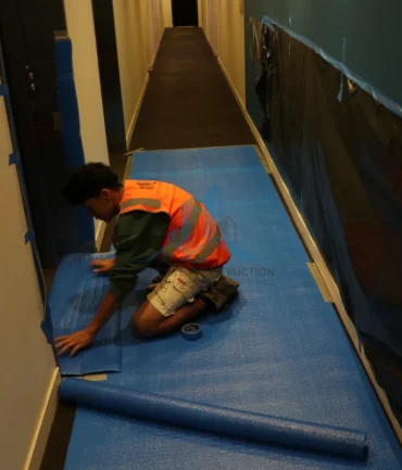 Apartment corridor floor protection during balcony repairs