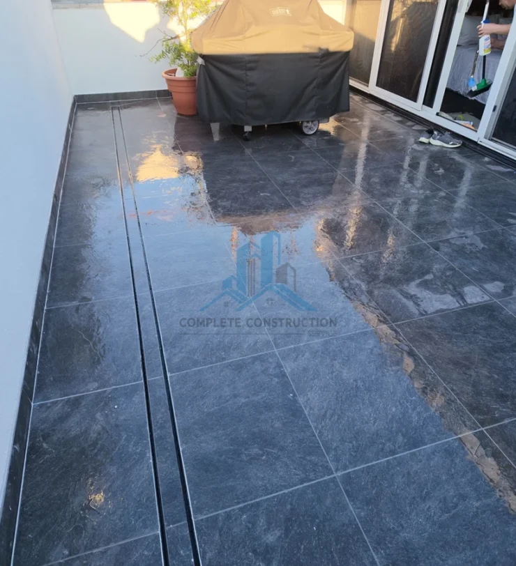 Finished dark tiled balcony in Victoria Street Melbourne