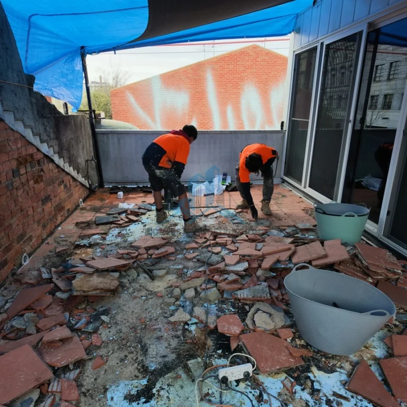 Existing balcony tiles and screed being demolished in Melbourne