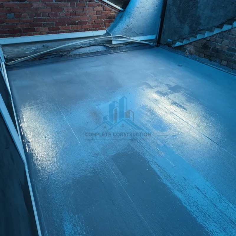 Waterproofing membrane applied to balcony floor and edges