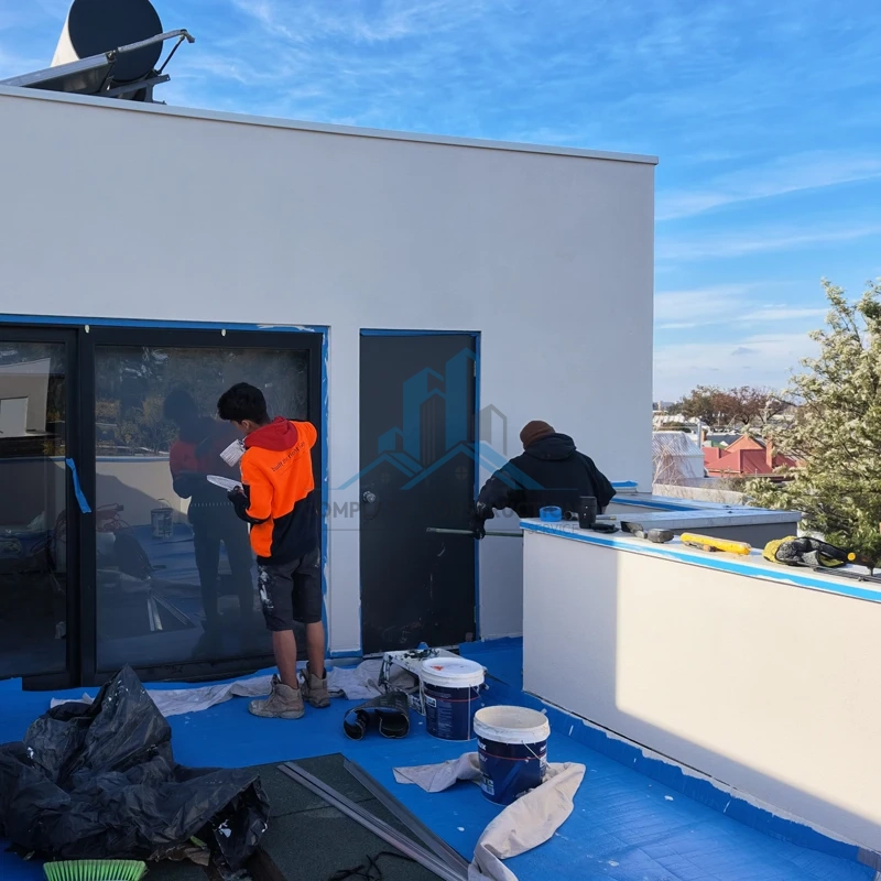 Applying protective wall coating on terrace, Brunswick